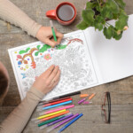 Woman coloring an adult coloring